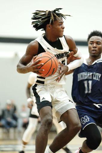 A vertical shot of a young male player on the court at a fall Indiana high school basketball game
