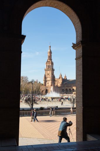 Tourists walking and taking photos in the beautiful Plaza de Espana
