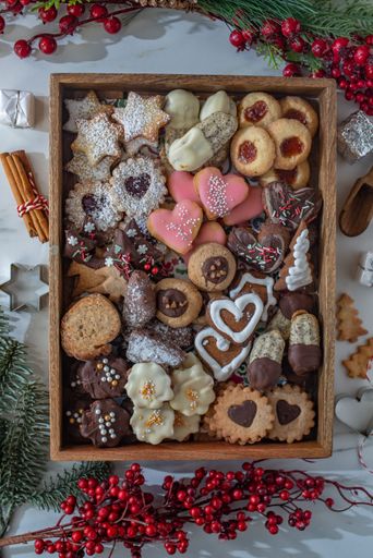 An assortment of homemade German Christmas cookies presented in a decorative display