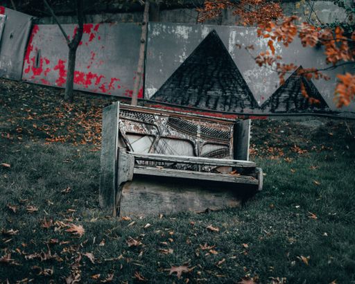 An old abandoned broken piano left outdoors