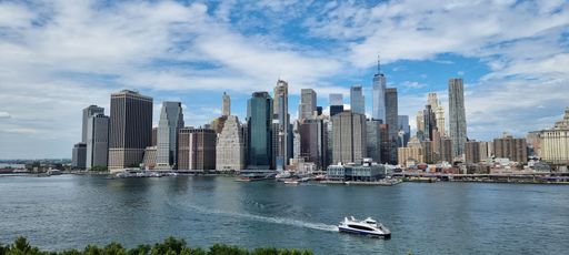 A beautiful landscape view of Manhattan with the east river in the foreground
