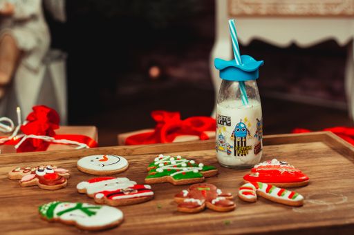 Cute gingerbread, Christmas tree, snowman, Santa Claus and reindeer shape cookies on a wooden board