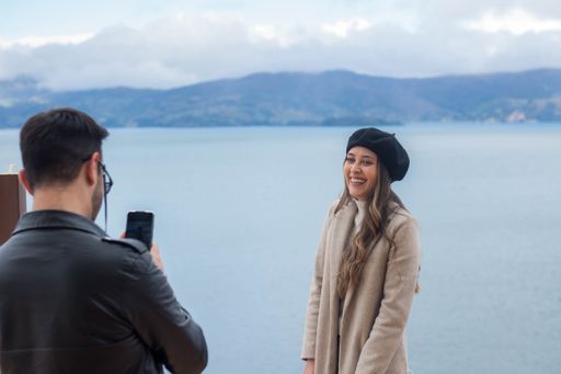 A selective focus shot of a cute couple photographing each other