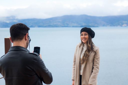 A selective focus shot of a cute couple photographing each other