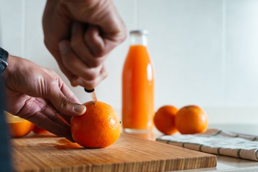 A closeup shot of squeezing orange juice