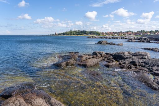 A beautiful rocky coast on the island of Bornholm, Denmark under the cloudy sky