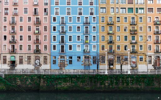 The beautiful architecture of colorful buildings near the water canal