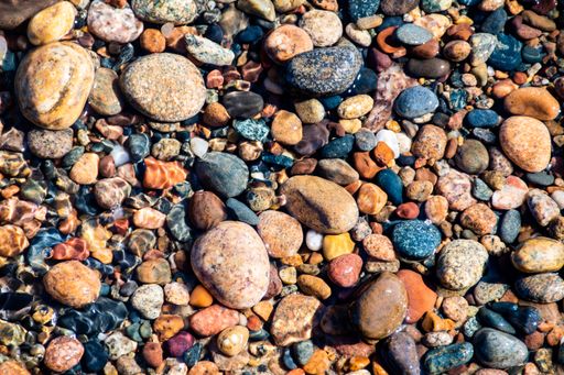 Beautiful colored agate stones along the shoreline of Lake Superior
