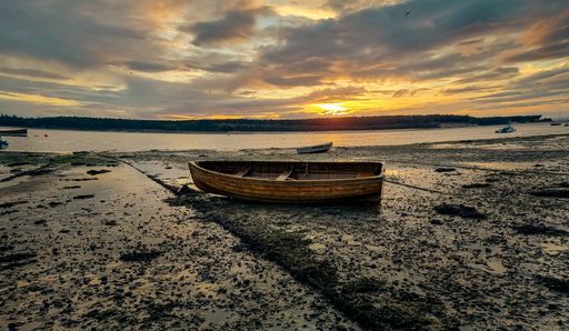 Boat on the water. passing by the harbor I notice this perfect image with a sunset in the background.