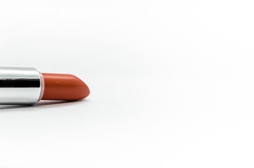 A closeup shot of red lipstick isolated on a white background