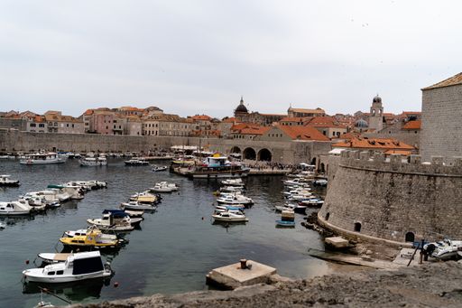 An aerial shot of boats in the harb in Dubrovnik in Croatia