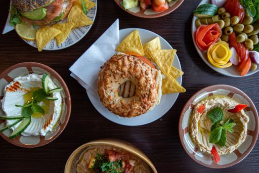 An overhead shot of different side dishes on a wooden surface