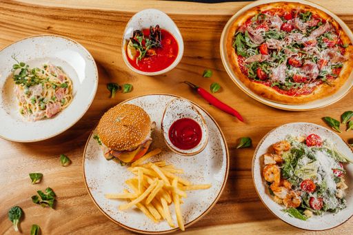 A closeup of the various delicious and tasty fresh food on a wooden surface