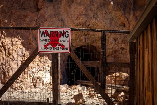 danger sign on an old abandoned mine in the desert of the wild west
