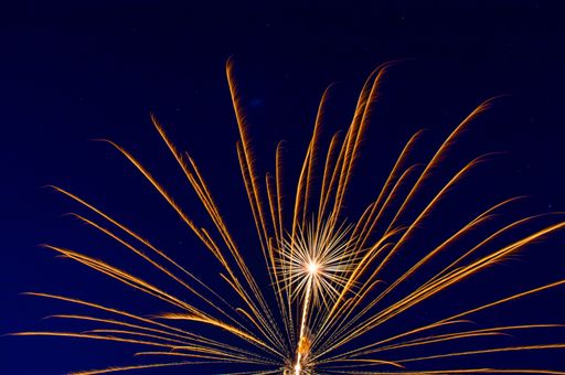 A low angle shot of colorful fireworks with long exposure at night