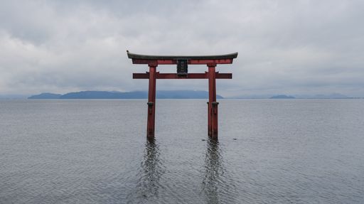 The floating gate of Shirahige Shrine stands on Lake Biwa
