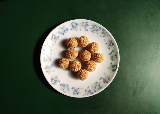 Traditional Assamese sweet called Tilor Laru in Assam, India. These are made of melted jaggery and roasted sesame seeds shaped into small balls.