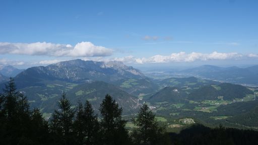An aerial shot of the beautiful Bavarian Alps surrounded by clouds captured in Germany