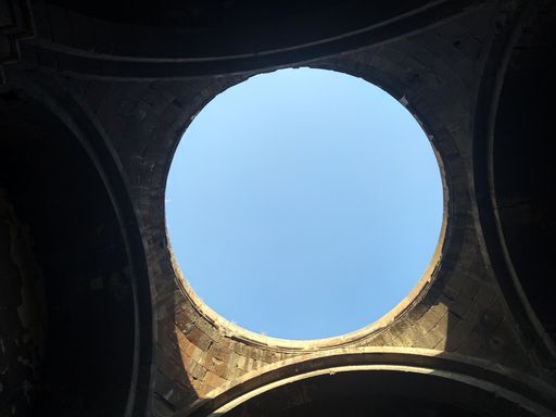 A low angle shot of an open ceiling of Aruch Cathedral Monastery Complex in Armenia