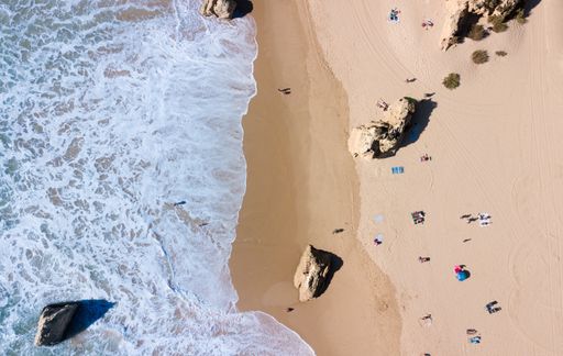 An aerial shot of Praia da Torralta - Torralta Beach, Alvor, Portimao, The Algarve, Portugal