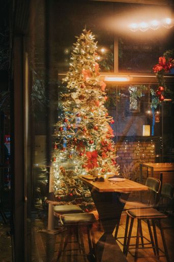 A colorful Christmas tree in a beautifully decorated empty cafe