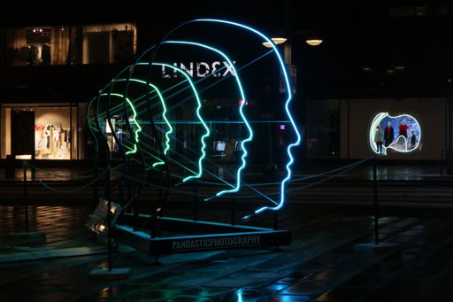 An artwork with neon lights at night in Stockholm, Sweden.