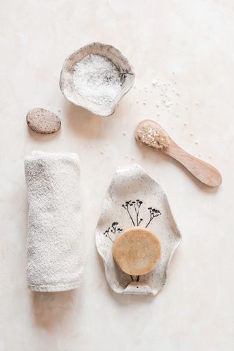 A vertical top view of eco-friendly zero waste bathroom accessories or supplies for personal hygiene