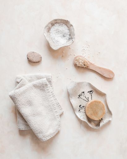 A vertical top view of eco-friendly zero waste bathroom accessories or supplies for personal hygiene