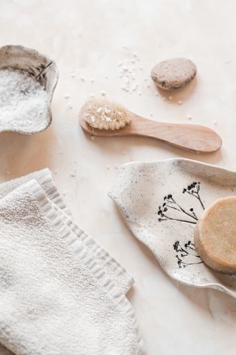 A vertical top view of eco-friendly zero waste bathroom supplies for personal hygiene