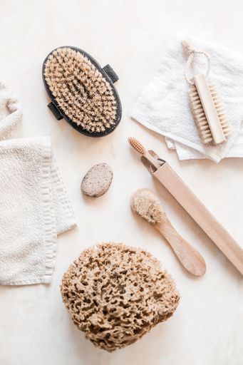 A vertical top view of natural eco-friendly zero waste bathroom supplies for personal hygiene