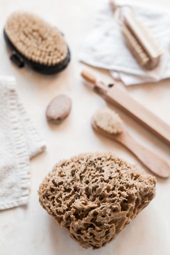 A vertical top view of natural eco-friendly zero waste bathroom supplies for personal hygiene