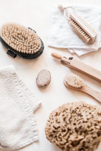 A vertical top view of natural eco-friendly zero waste bathroom supplies for personal hygiene