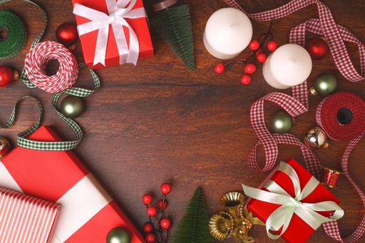 A wooden surface with a copy space surrounded by the Christmas decorations