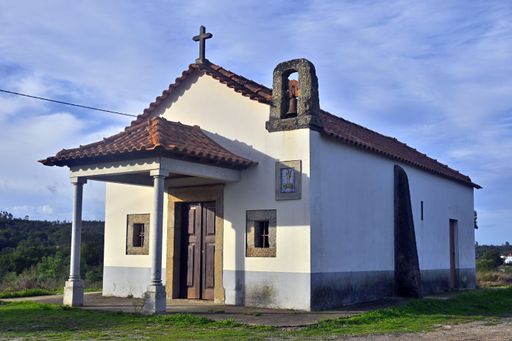 A beautiful white chapel isolated against the blue sky