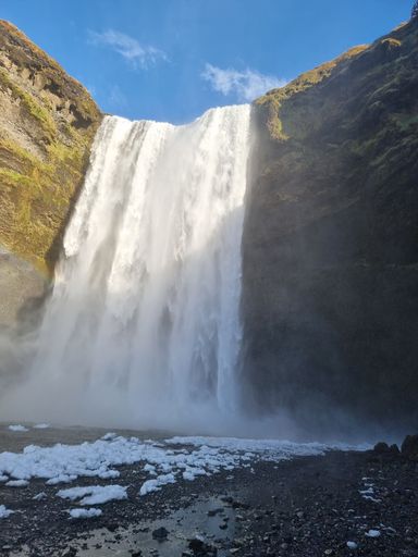 A vertical shot of Skogafoss waterfall in Iceland