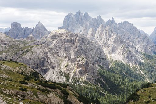 A mesmerizing view of a beautiful mountainous landscape with high green trees in South Tyrol, Italy