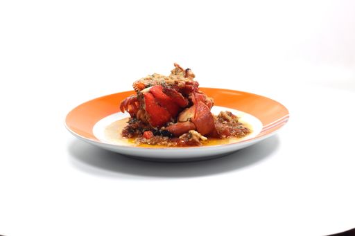 A closeup shot of shellfish ragout with lobster isolated on white background