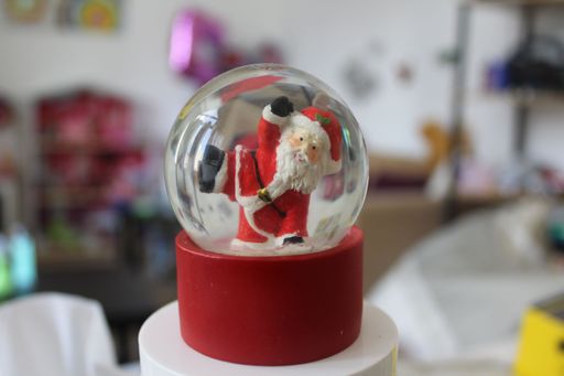A closeup shot of the snowball with the Santa inside