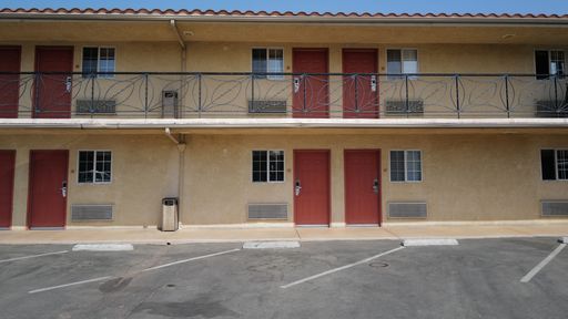 An exterior of a Motel outside in Burbank city with backyard