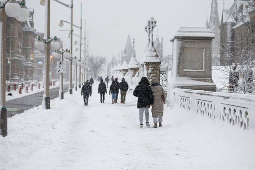 The people walking outdoors during a cold snowy day in Ottawa, Canada