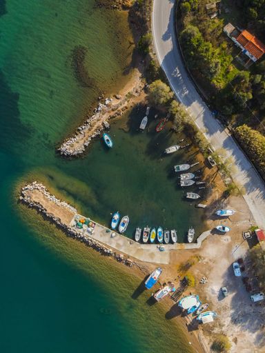 A vertical aerial top view of boats on a pier in Marmaro,Lesvos,Greece
