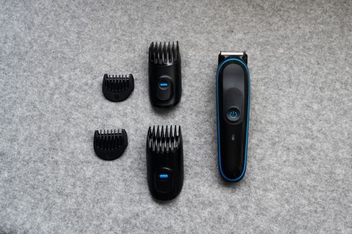 View of a Hair clipper with accessories on a gray table