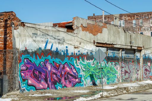 A graffiti wall on the side of an old warehouse building in Kansas City, USA