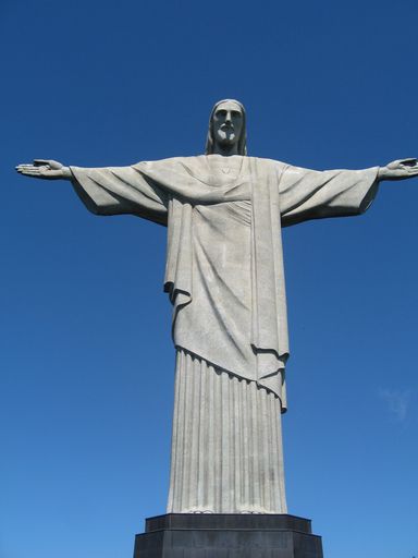 A vertical shot of the famous Christ the Redeemer statue in Rio against the clear blue sky