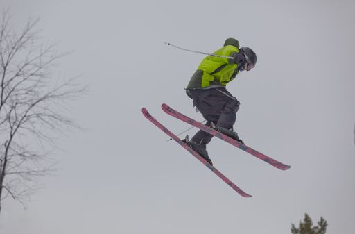 A shot of a snow skier during an impressive jump at the Maryland open freestyle competition