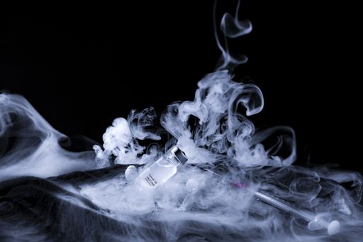 A Covid-19 vaccine preserved at very low temperature with a lot of steam of dry ice - new normal concept