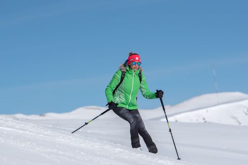 Grandvalira, Andorra: 2020 December 31: Woman pratice Ski mountaineering going up the Pyrenees mountains in Andorra on 2020.