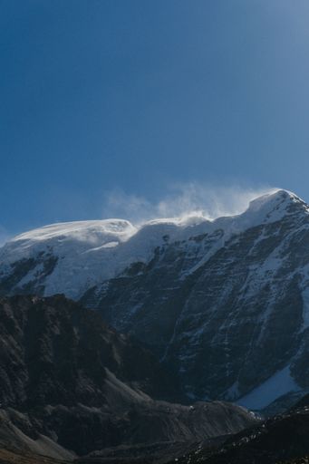 A vertical shot of snowy mountains near Gurudongmar lake, Sikkim, India