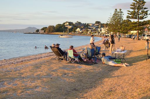View of group of people at Bucklands Beach on new 2021 year eve