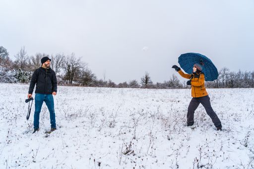 A couple playing with snowballs at a park during winter in the town of Opakua near Vitoria in Araba, Basque Country. Spain
